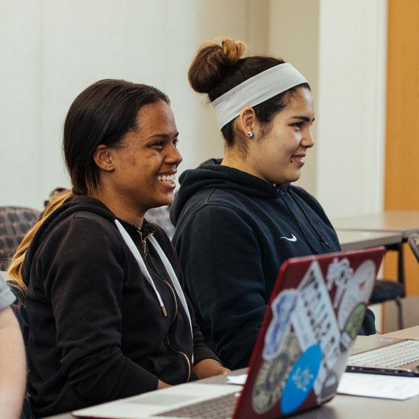 Two creative writing major students participating in a class discussion.